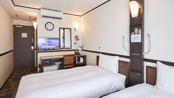 Desk, laptop workspace, bed sheets