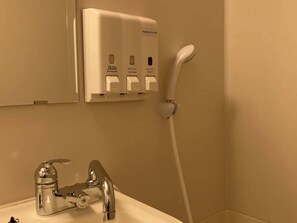 Combined shower/tub, deep soaking tub, free toiletries, hair dryer