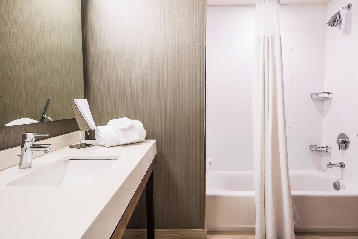 room, 2 queen beds | bathroom | shower, hair dryer, towels