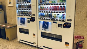 Two vending machines in a public area, each stocked with beverages and snacks. - Toyoko Inn Osaka Temmabashi Otemae (Osaka)