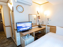 Desk, laptop workspace, free WiFi, bed sheets