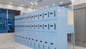A self-service locker area with multiple lockers, each marked with a number.