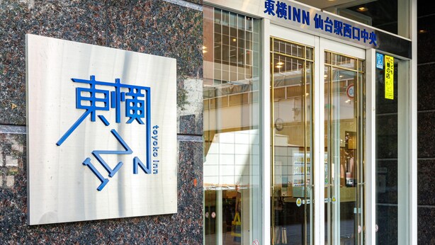 A hotel entrance with a sign reading "Toyoko Inn" and a sign above the door indicating "10th floor". - Toyoko Inn Sendai Station Nishi Chuo (Sendai)