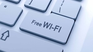 A close-up of a keyboard with a key labeled "Free Wi-Fi". - RedDoorz Near Trans Studio Mall 3 (Bandung)