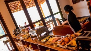 A breakfast buffet with various food items and a coffee station. - Gocta Andes Lodge (Cocachimba)