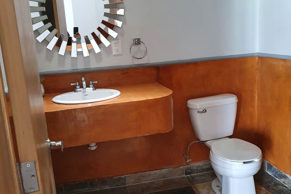 superior studio suite | bathroom | shower, free toiletries, hair dryer, towels