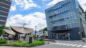A modern building with a glass facade and a large entrance. - Toyoko Inn Tokushima Station Bizan (Tokushima)