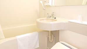 A bathroom with a white sink, a mirror, and a towel hanging on the wall. - Toyoko Inn Hanshin Amagasaki Ekimae (Amagasaki)
