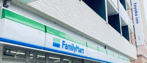 A FamilyMart store with a visible ATM sign above the entrance.