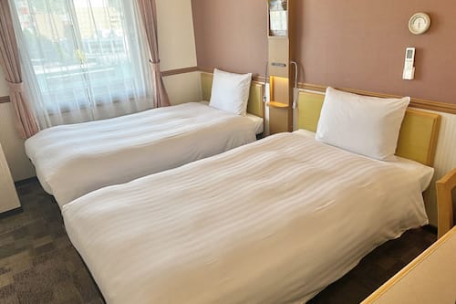 Premium bedding, desk, blackout drapes, iron/ironing board