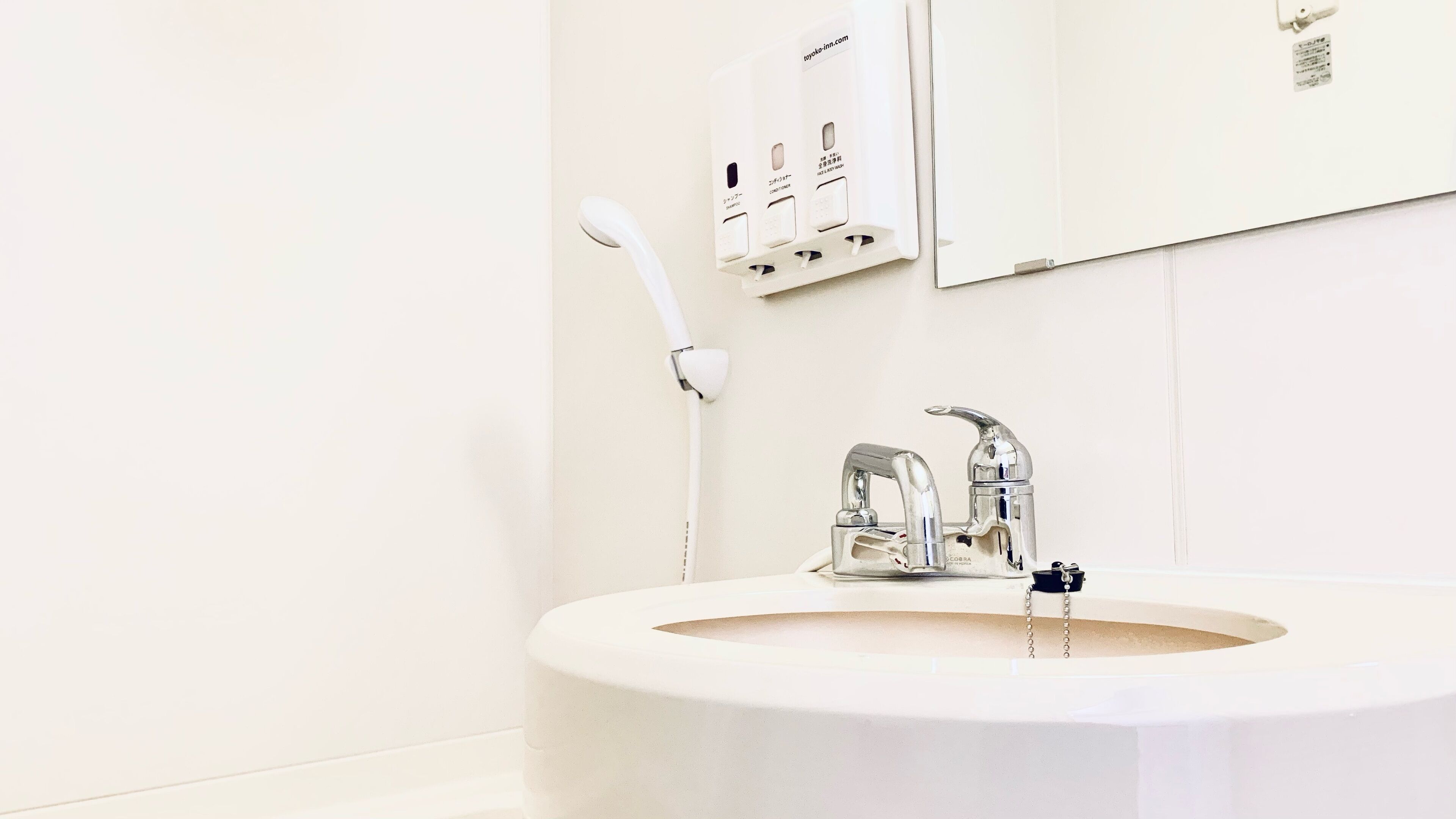 combined shower/bathtub, deep-soaking bathtub, slippers