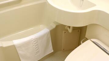 Combined shower/tub, free toiletries, hair dryer, slippers