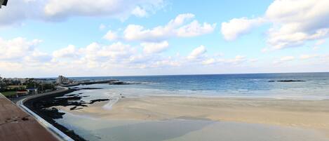 A beach with clear skies and calm waters.