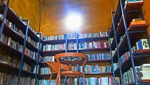 A library with bookshelves on both sides, a wicker chair in the center, and a bright light source above. - The Soul (Wenshan)
