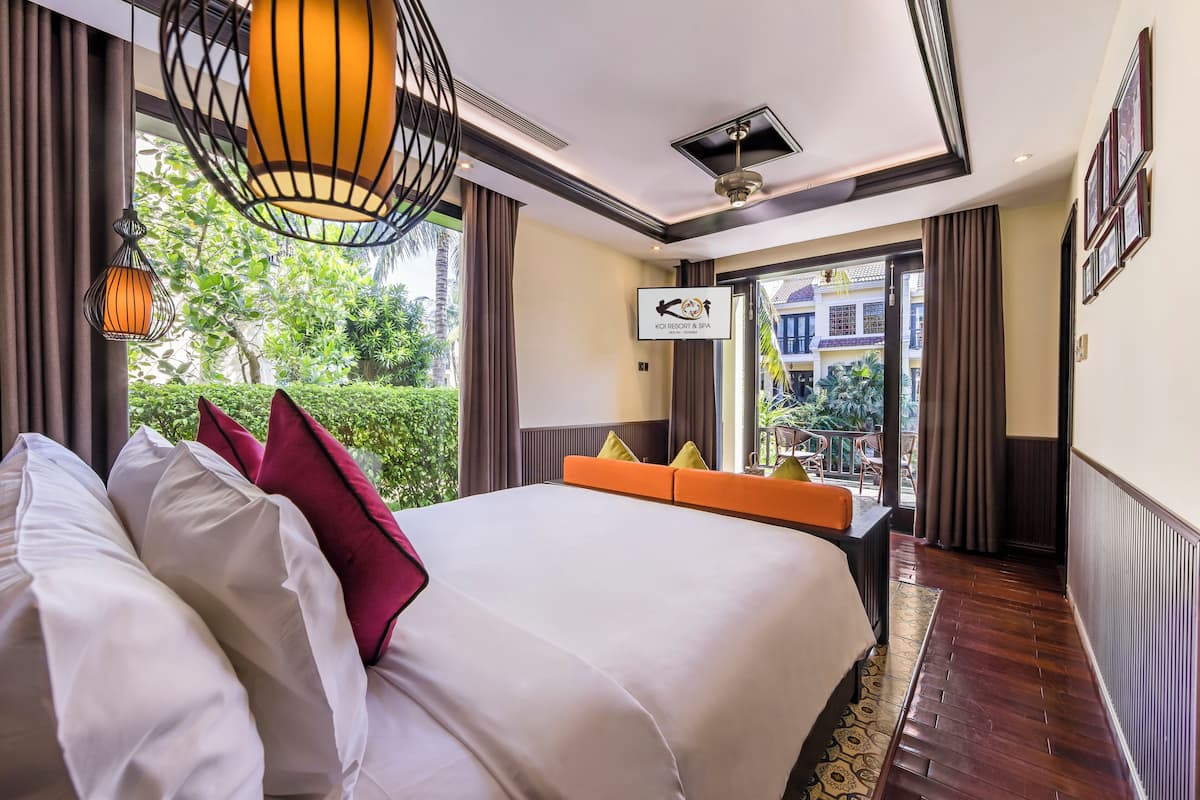 Bungalow, vue lagon | 4 chambres, minibar, coffres-forts dans les chambres, bureau
