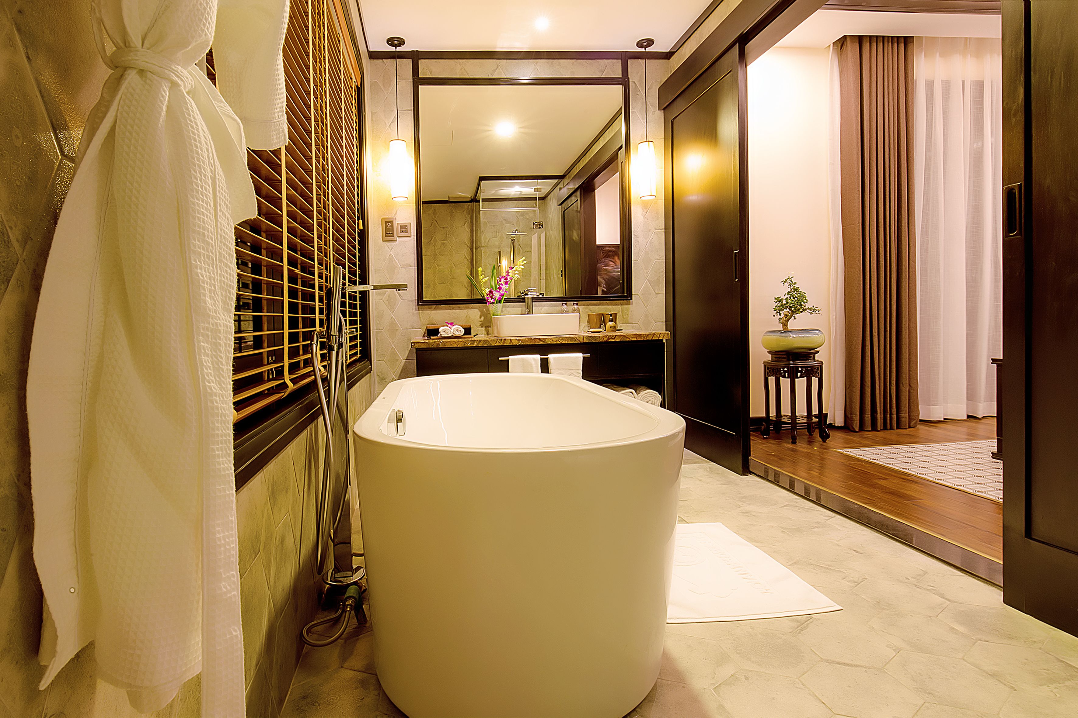 deep-soaking bathtub, rainfall showerhead, free toiletries, hair dryer