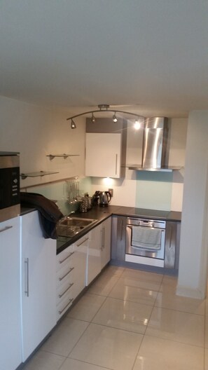 Apartment, 2 Bedrooms | Private kitchen | Full-size fridge, microwave, oven, stovetop