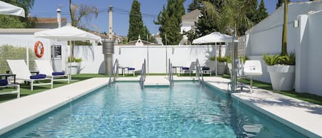 Seasonal outdoor pool, pool umbrellas, pool loungers