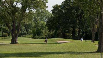 Golfers can enjoy a challenging game on this well-maintained course with a sand bunker.