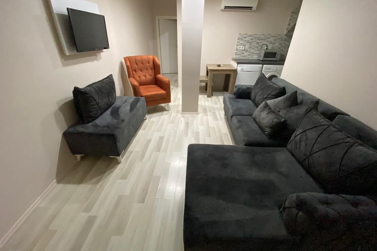 Family Quadruple Room, 1 Bedroom | Living room | LCD TV