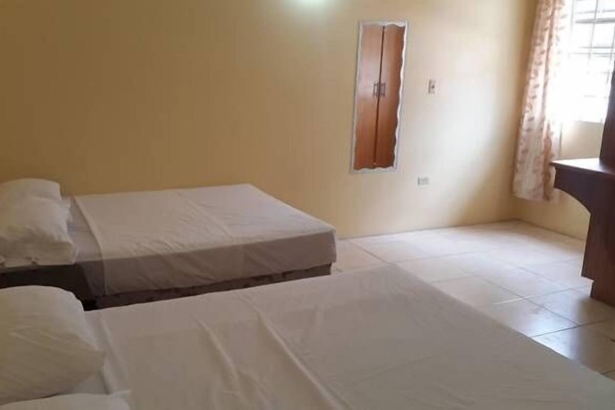 Comfort Apartment, 2 Double Beds, Kitchen, Ground Floor (Buccoo Reef) | 1 bedroom, laptop workspace, iron/ironing board, WiFi (free)