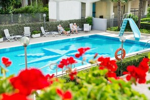 Seasonal outdoor pool, pool umbrellas, pool loungers