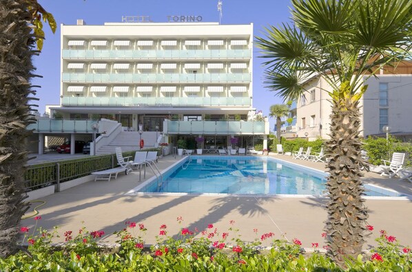 Seasonal outdoor pool, pool umbrellas, pool loungers
