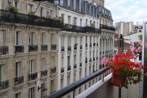 A row of classic European-style buildings with uniform balconies and shutters. - Chambre d'Amis (Chambres d'Hôtes/BnB/Guest House) (Paris)
