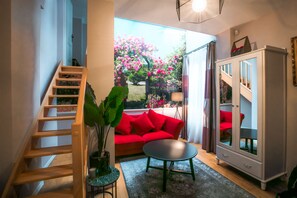 Deluxe Duplex, 1 Bedroom | Living area | 164-cm flat-screen TV with satellite channels, TV