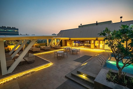Rooftop bar, poolside views, open daily. Radisson Blu Pune Hinjawadi