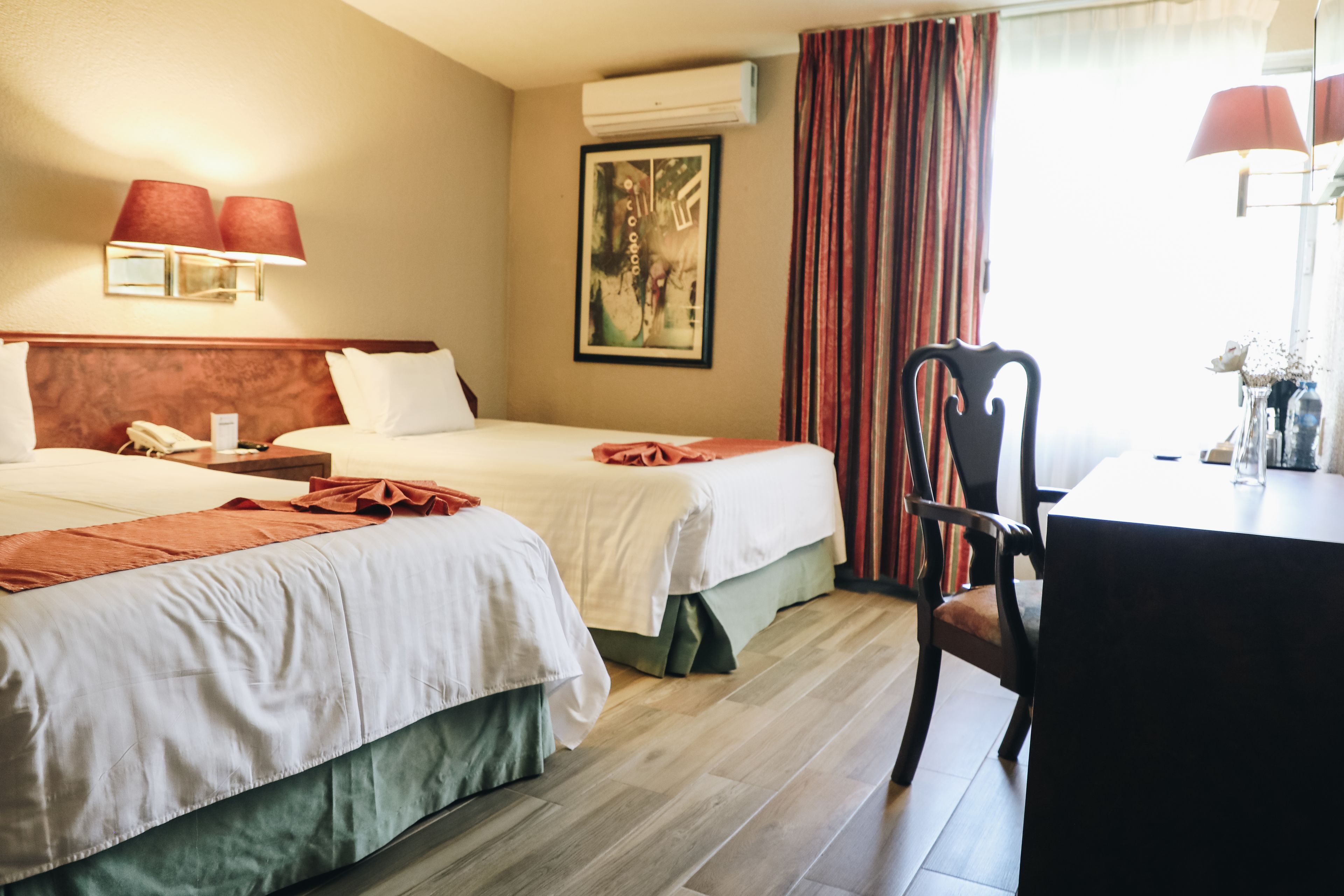junior suite, 2 double beds | in-room safe, desk, laptop workspace, iron/ironing board