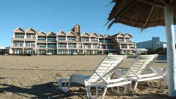 On the beach, sun loungers, beach umbrellas, beach towels