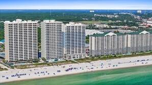 A beachfront hotel with multiple high-rise buildings, a sandy beach, and a clear view of the ocean. - Twin Palms Resort by Panhandle Getaways (Panama City Beach)
