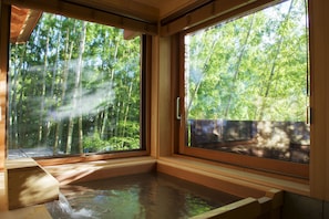 Separate tub and shower, spring water tub, designer toiletries
