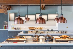 A buffet setup with various food items and serving utensils. - Village Club Kerlannic (Arzon)