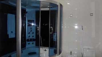 Deep soaking tub, rainfall showerhead, free toiletries, towels