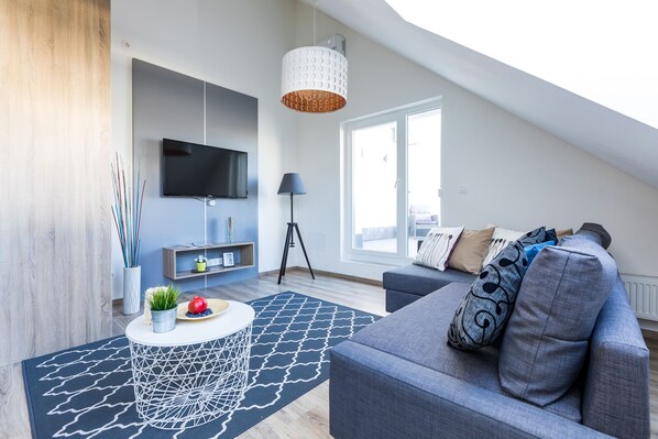 Penthouse, 2 Bedrooms | Living area | 100-cm flat-screen TV with cable channels, TV