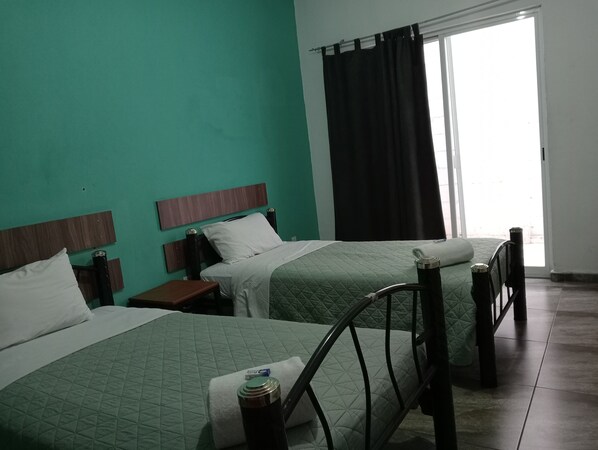 Basic Shared Dormitory, 3 Bedrooms, Shared Bathroom | Desk, laptop workspace, blackout drapes, iron/ironing board - La Siesta del Patron (Querétaro)