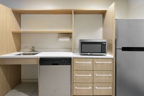 Desk, laptop workspace, blackout drapes, iron/ironing board