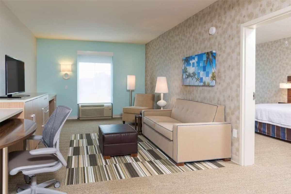 Desk, laptop workspace, blackout drapes, iron/ironing board