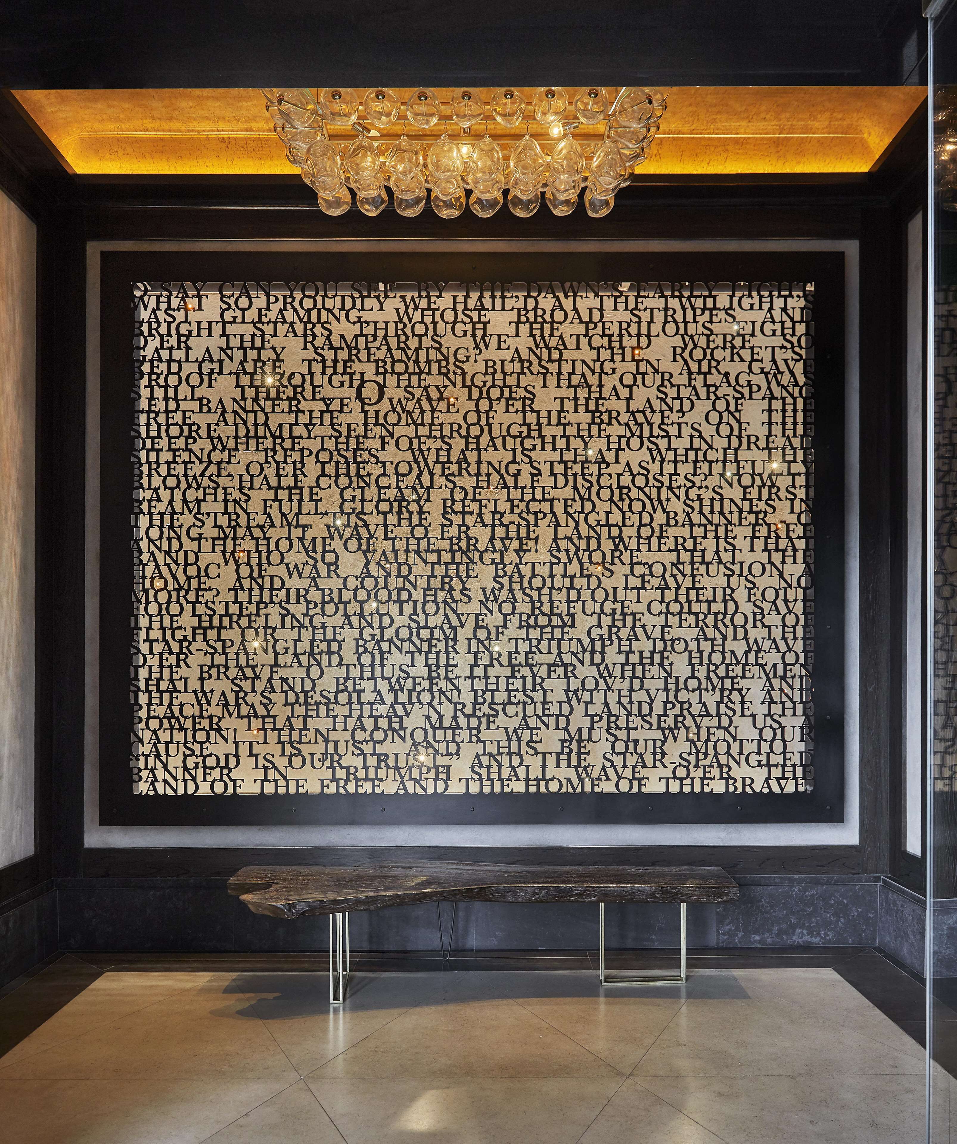 A wall with a large, patterned text display.