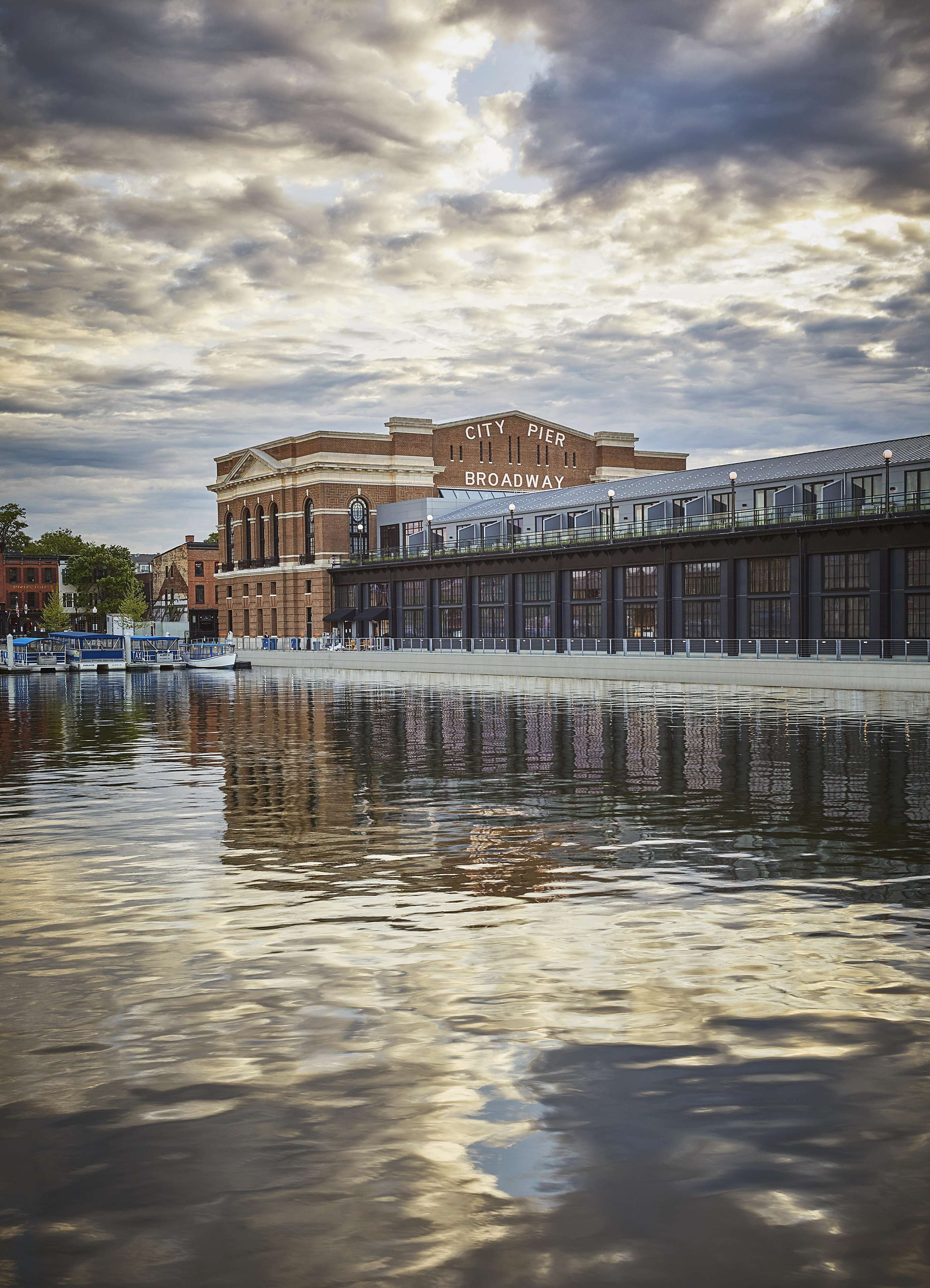 A waterfront view with a building labeled "City Pier Broadway."