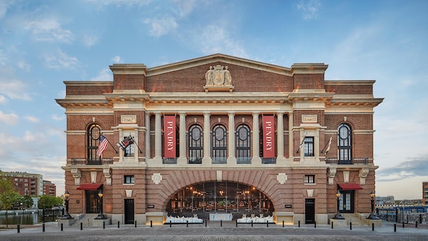 A historic building with a prominent facade, large arched windows, and a central entrance. - Pendry Baltimore (Baltimore)