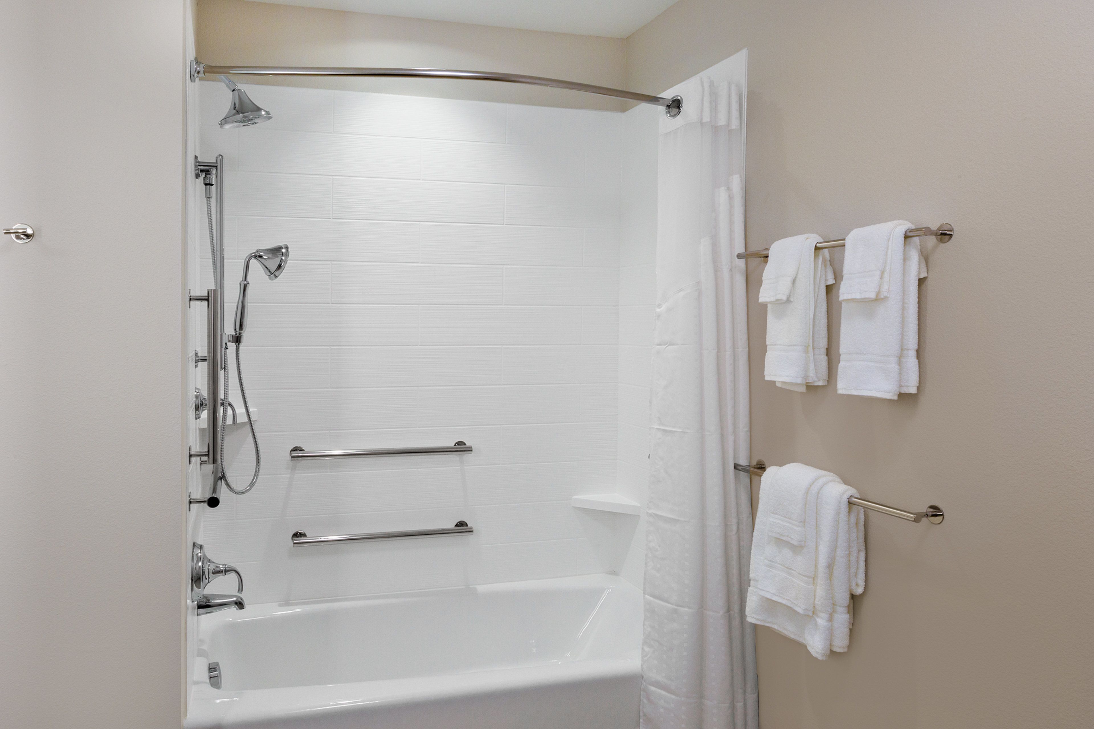 designer toiletries, hair dryer, towels, soap