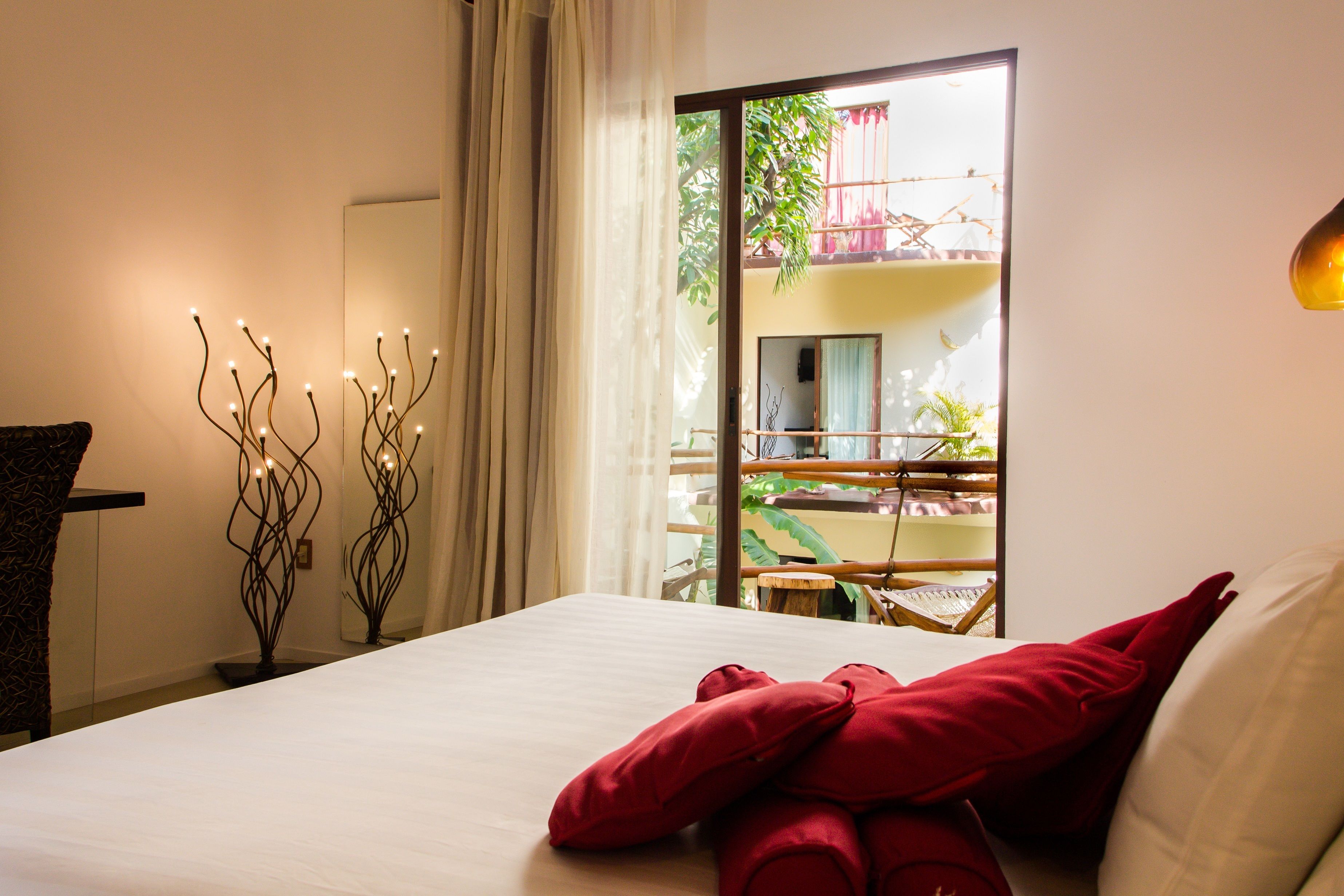 deluxe double room, 1 king bed, balcony, pool view | 1 bedroom, minibar, in-room safe, individually decorated