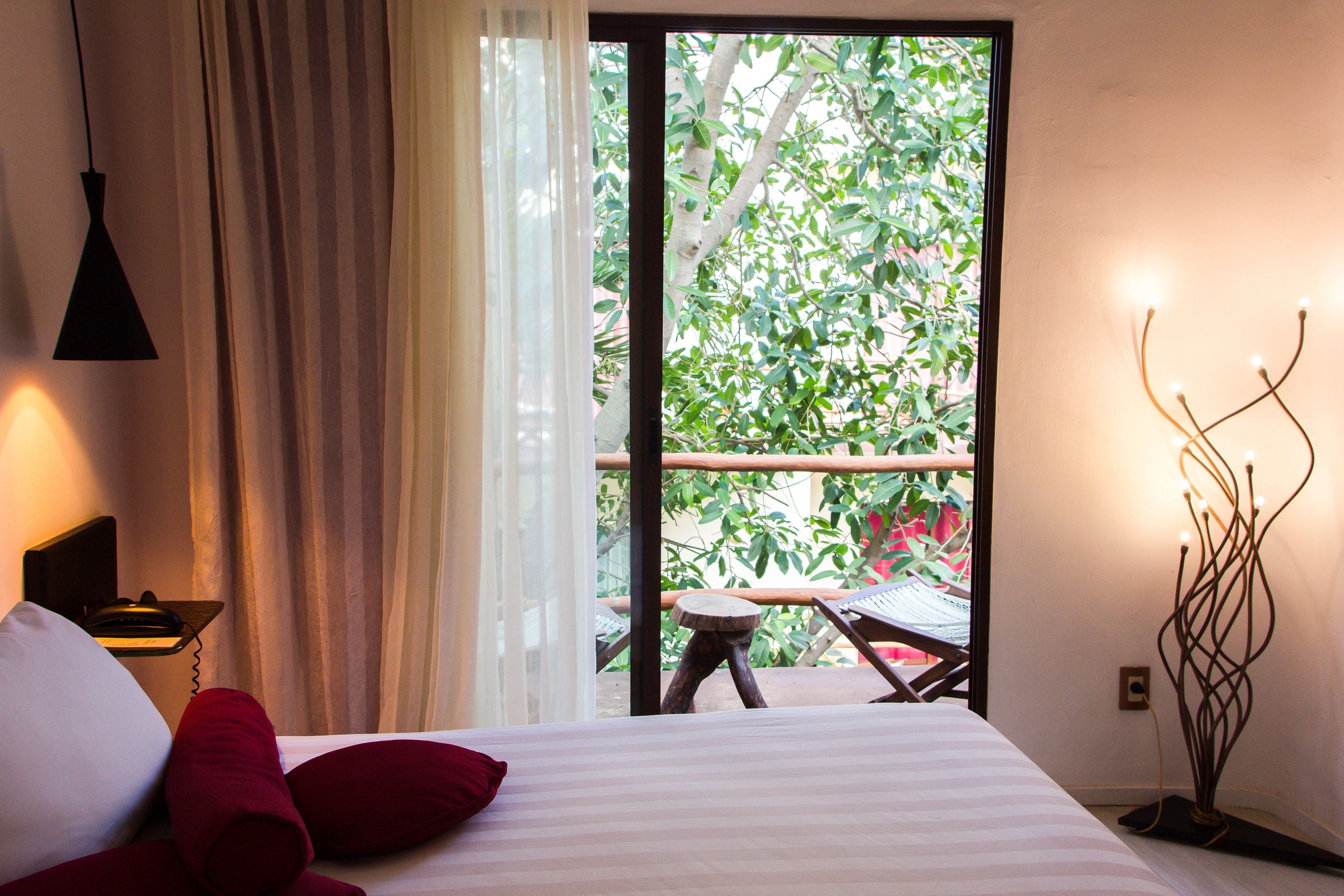 deluxe double room, 1 king bed, balcony, pool view | 1 bedroom, minibar, in-room safe, individually decorated