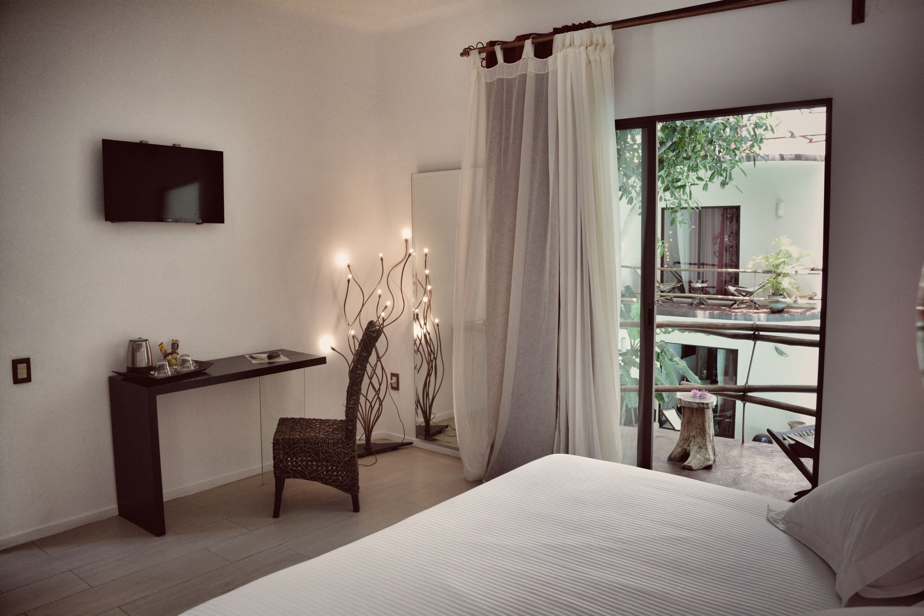 deluxe double room, 1 king bed, balcony, pool view | 1 bedroom, minibar, in-room safe, individually decorated