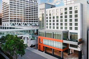 A modern hotel with a glass facade, a prominent 'WESTIN' sign, and a rooftop terrace. - The Westin Milwaukee (Milwaukee)