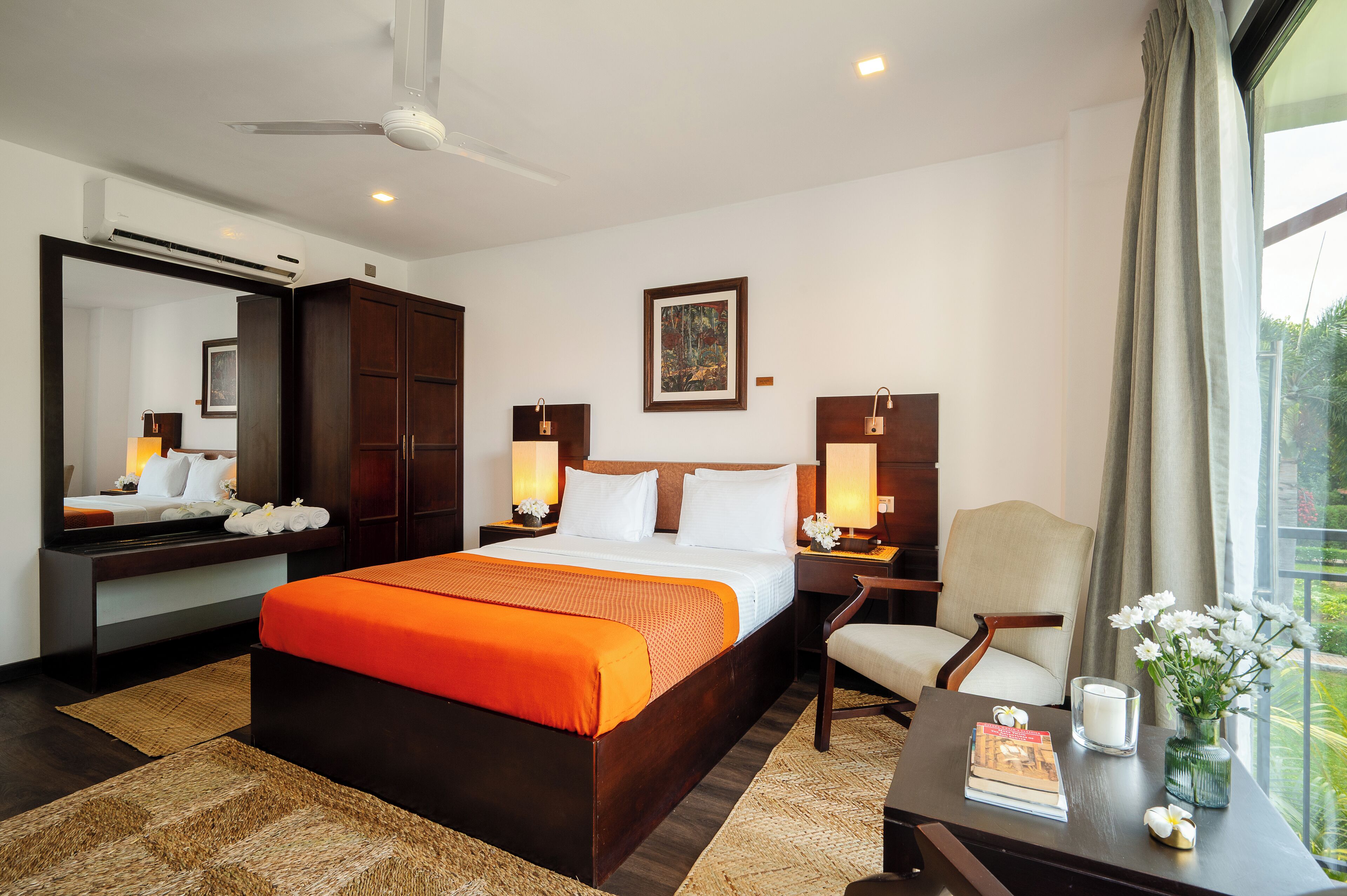 Deluxe Room with Garden Views | Minibar, in-room safe, individually decorated, individually furnished
