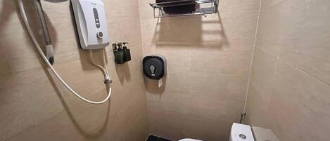A small, modern bathroom with a toilet, a shower, and a towel rack.